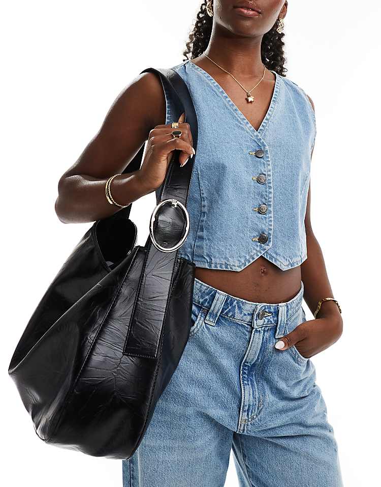 https://images.asos-media.com/products/glamorous-oversized-shoulder-bag-with-buckle-detail-in-black/206776149-1-black?$n_750w$&wid=750&fit=constrain