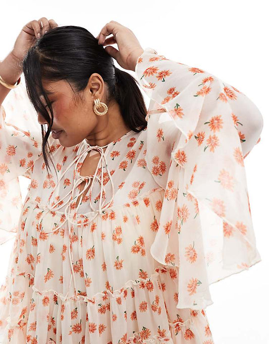 https://images.asos-media.com/products/asos-design-curve-tie-front-tiered-blouse-with-ruffle-cuffs-in-floral-print/207624225-2?$n_750w$&wid=750&fit=constrain