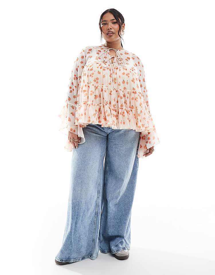https://images.asos-media.com/products/asos-design-curve-tie-front-tiered-blouse-with-ruffle-cuffs-in-floral-print/207624225-4?$n_750w$&wid=750&fit=constrain